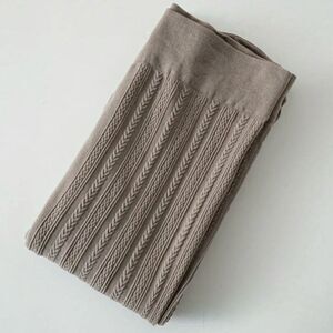 Solid ribbed taupe colored tights.